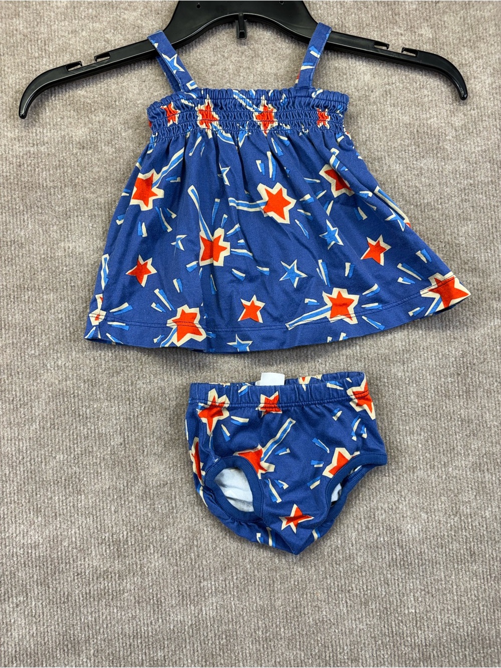 Hanna Andersson blue smocked dress featuring a red and blue "Sparkle and Shine"